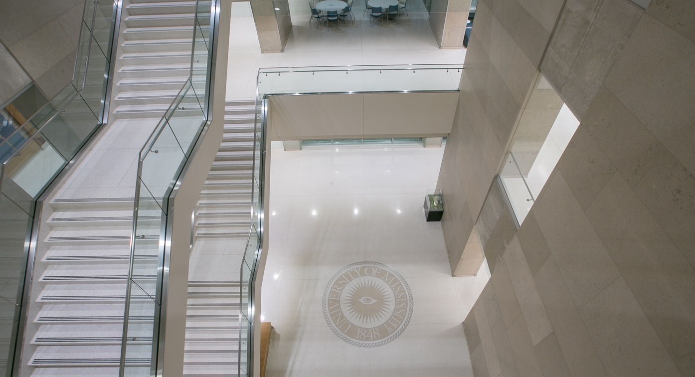 An aerial view of a building with stairs and a mosaic floor.