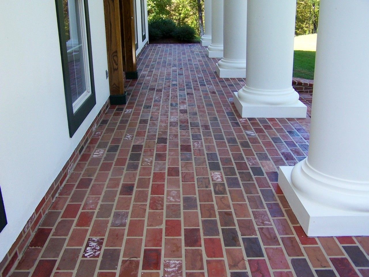 A Living Room With A Fireplace And A Flat Screen TV - Monroe, LA - Decorative Concrete Coatings LLC