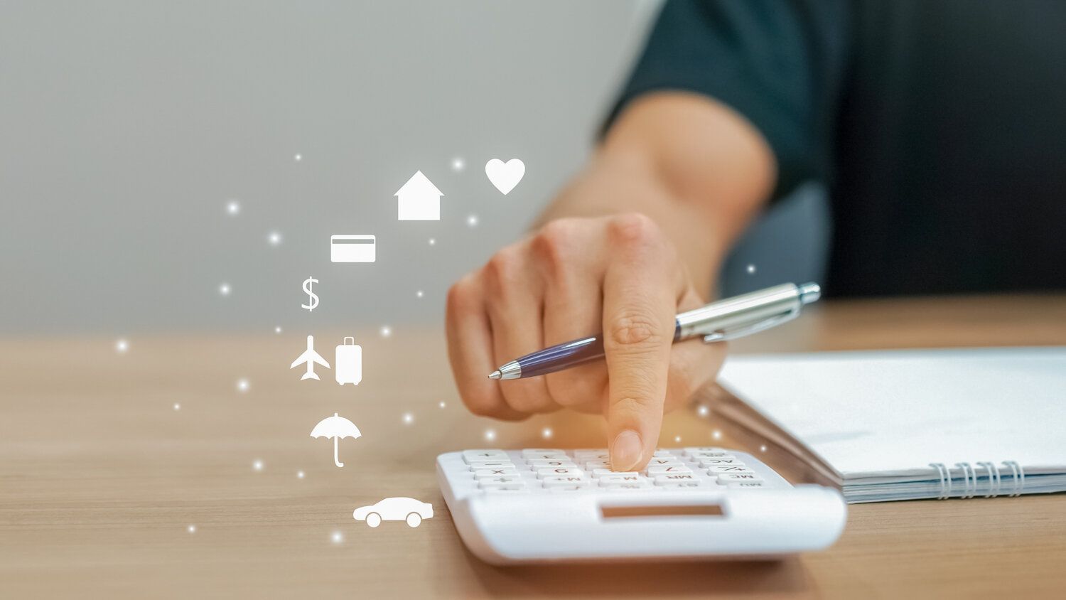 A person is using a calculator with a pen.