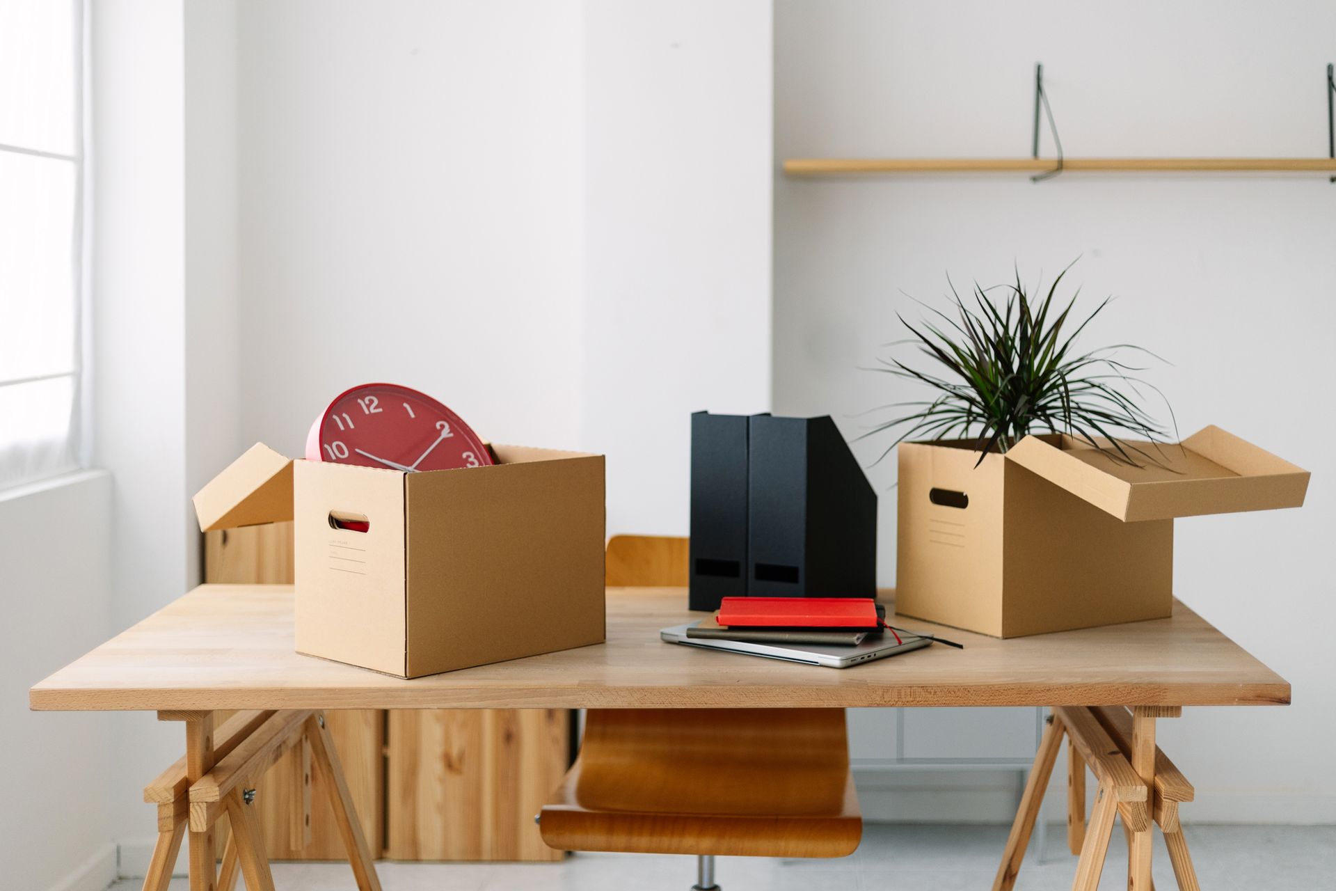 A wooden desk with three cardboard boxes on it - Bendigo, VIC - Bendigo Castlemaine Furniture Removals
