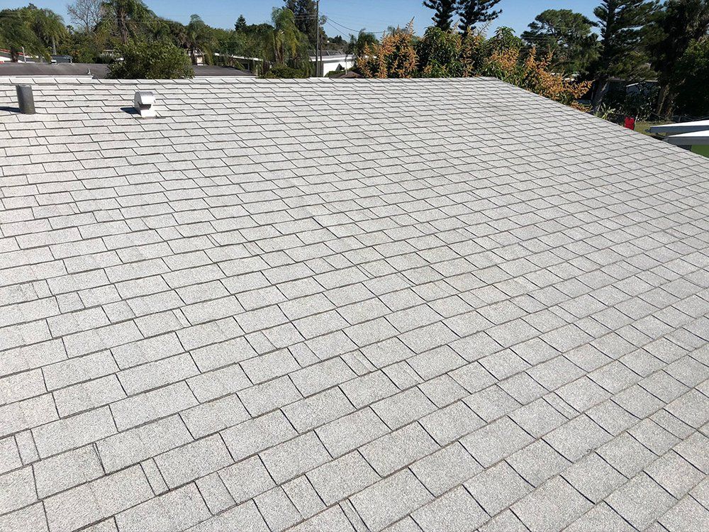 Shingles Roof with Chimney Pipe and Vent — Venice, FL — A-1 Roof Cleaning & Coating of Venice