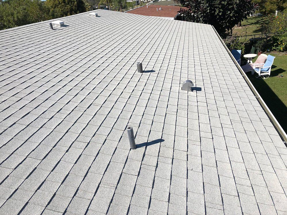 Roof with Chimney Pipe and Vent — Venice, FL — A-1 Roof Cleaning & Coating of Venice