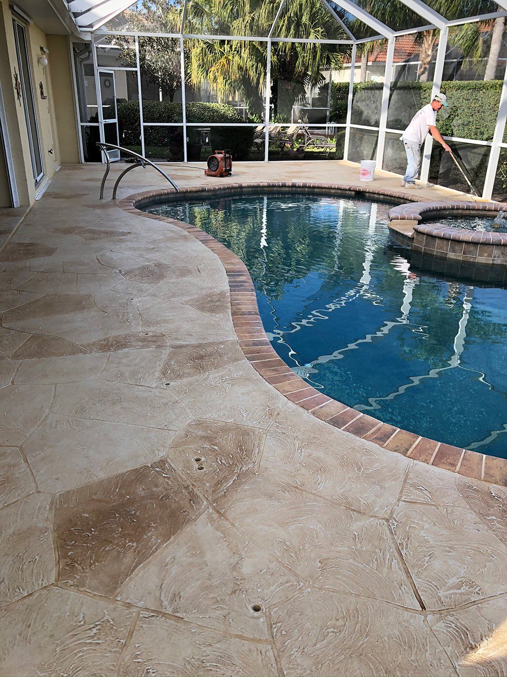 Man Cleaning Small Swimming Pool — Venice, FL — A-1 Roof Cleaning & Coating of Venice