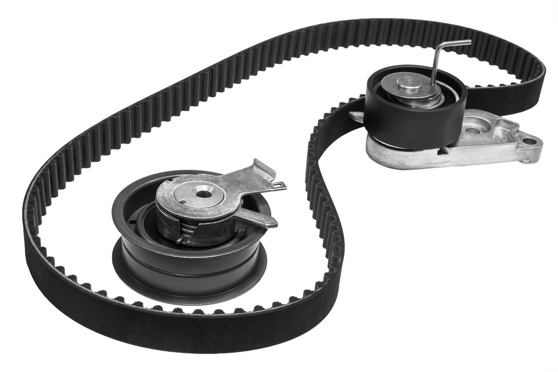 Black belt loosely looping around two timings of a car’s engine, against a white background. Black belt loosely looping around two timings of a car’s engine, against a white background.