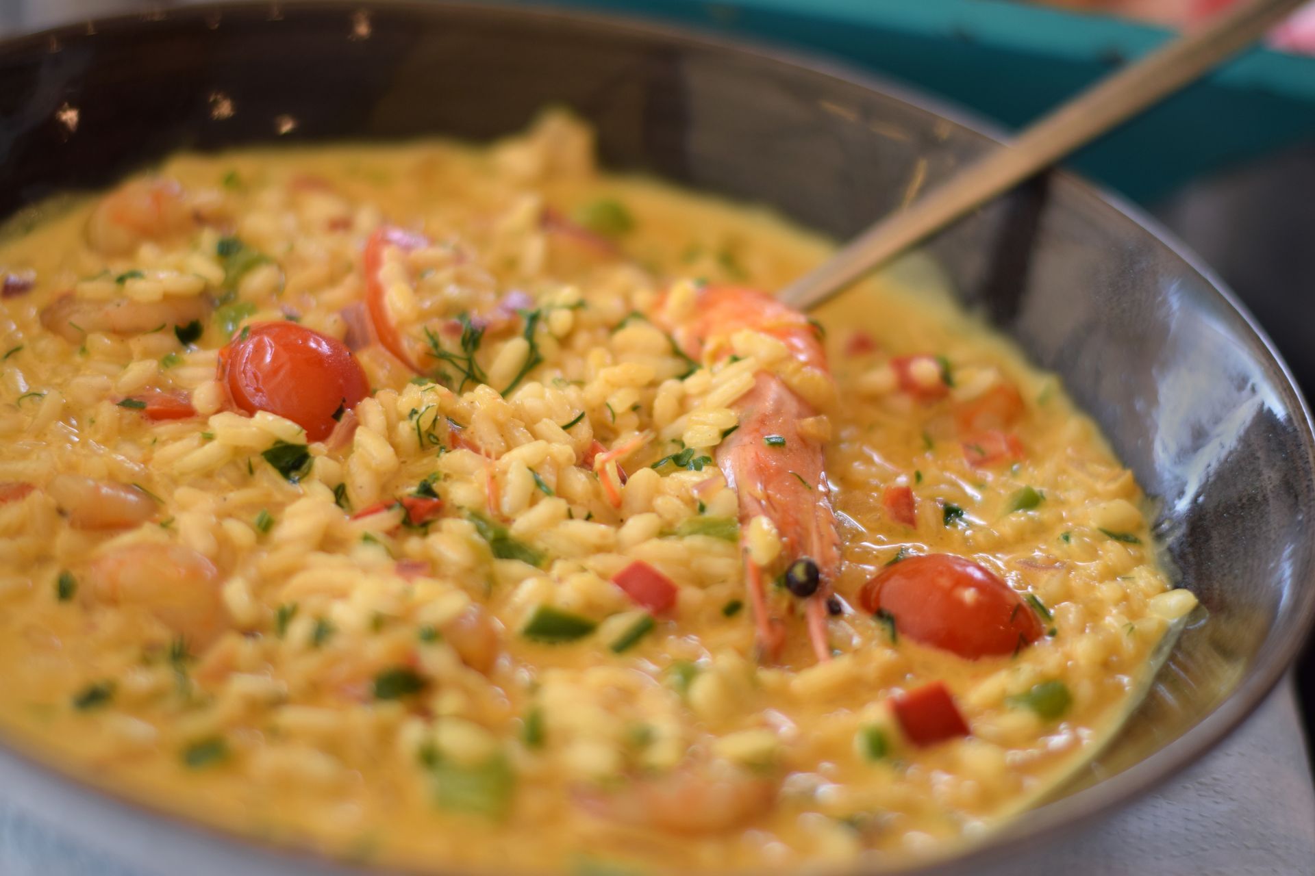 A close up of a bowl of food with a spoon in it.