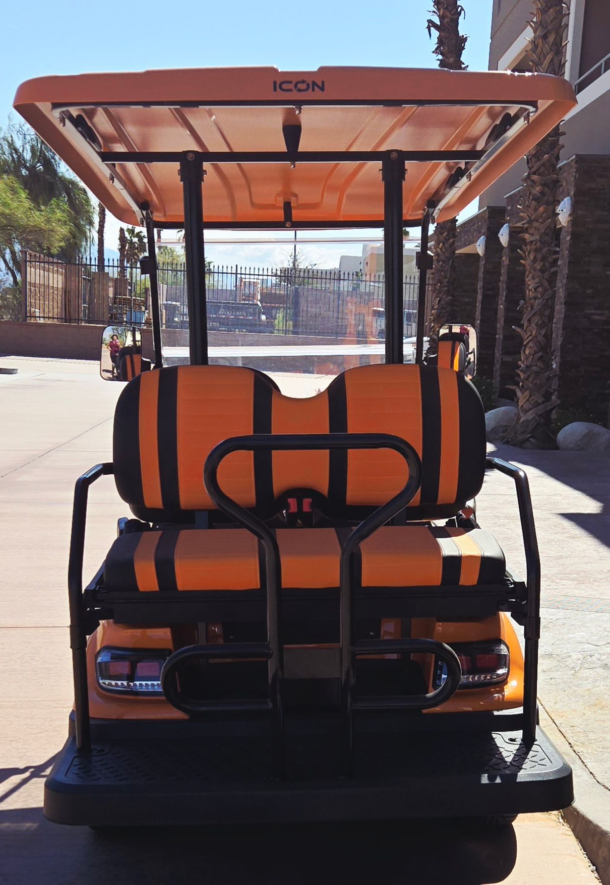 A golf cart with the word icon on the top