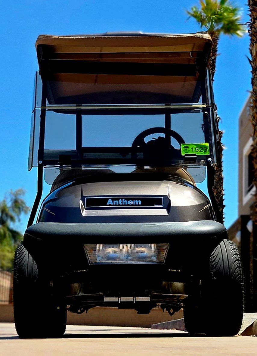A golf cart with the word anthem on the front