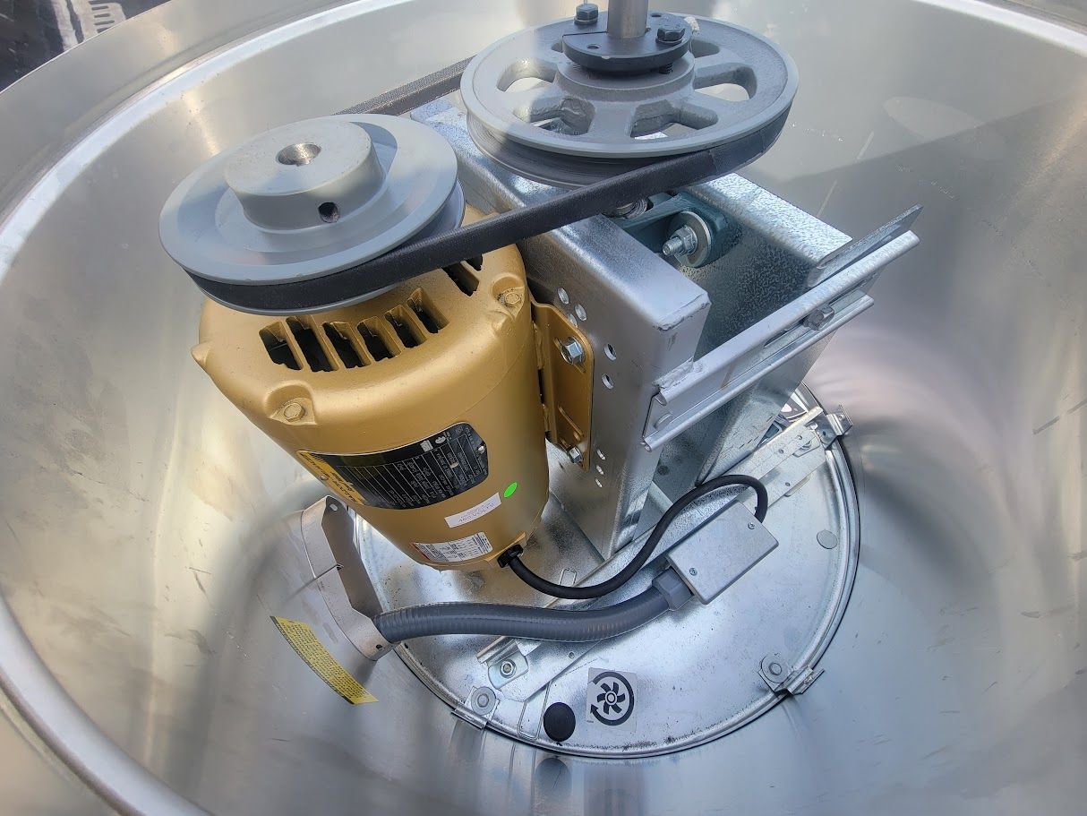 A close up of a motor in a stainless steel bowl
