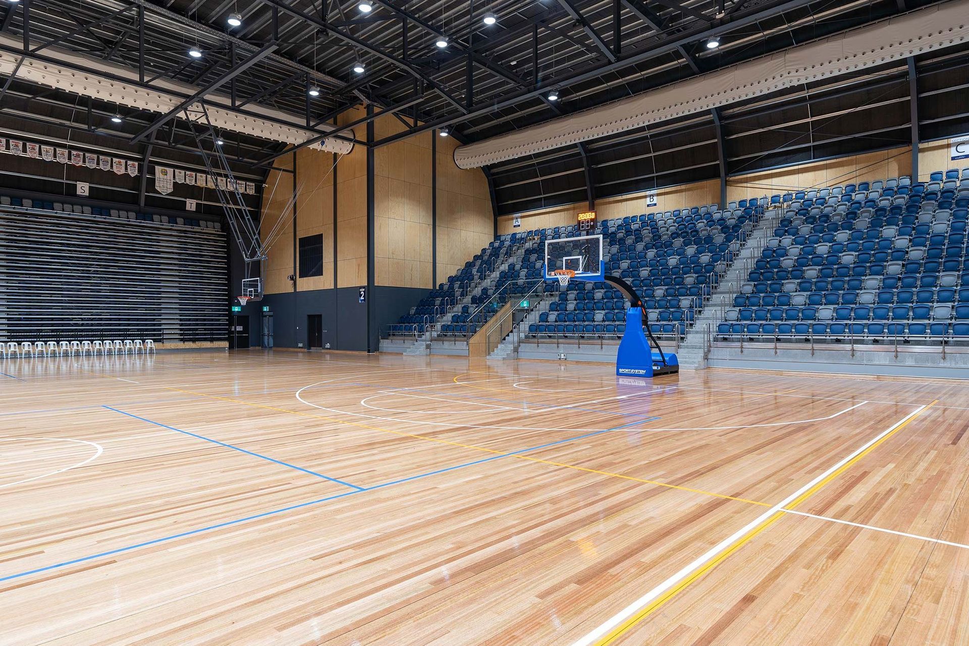 There is a basketball hoop in the middle of the court.