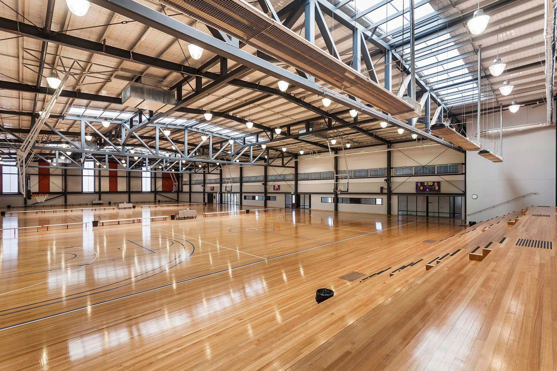 A large empty warehouse with a wooden floor