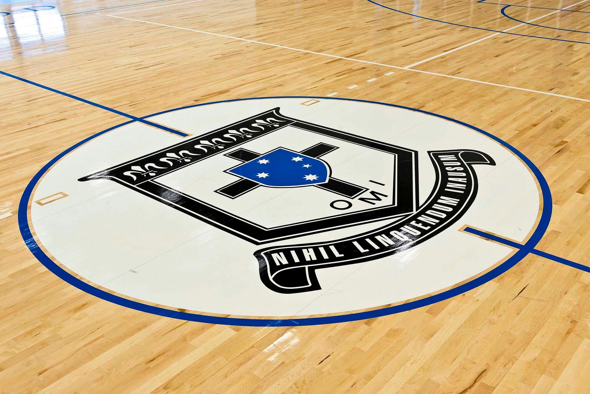 A logo on the floor of a basketball court