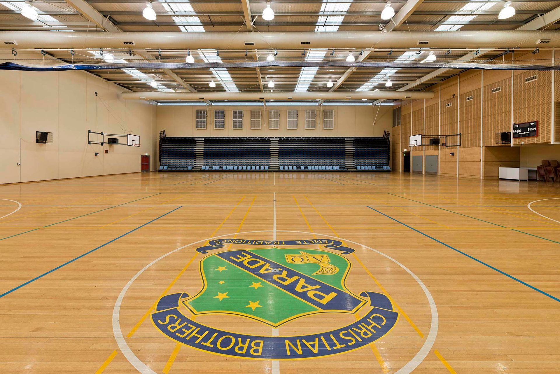 A basketball court with a christian brothers logo on it