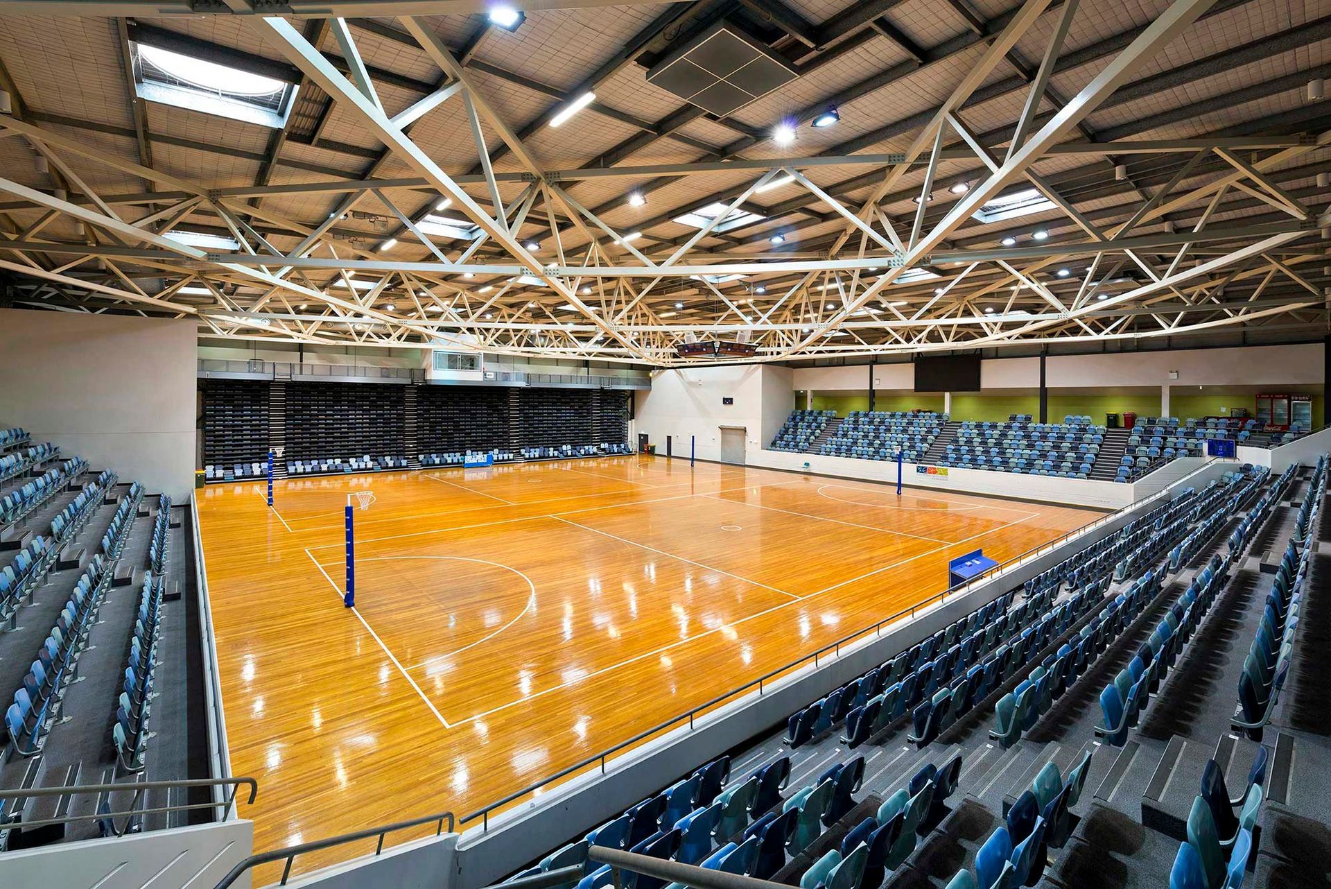 There is a volleyball court in the middle of the stadium.