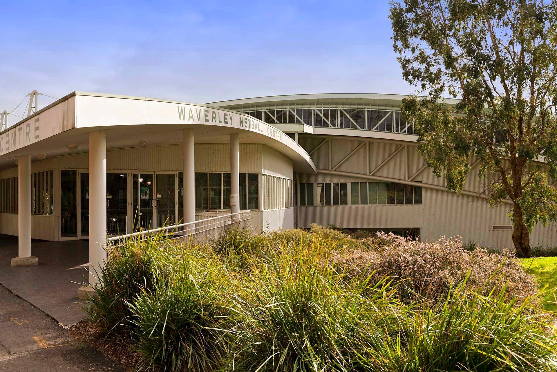 A large white building with a sign that says ' waterley ' on it