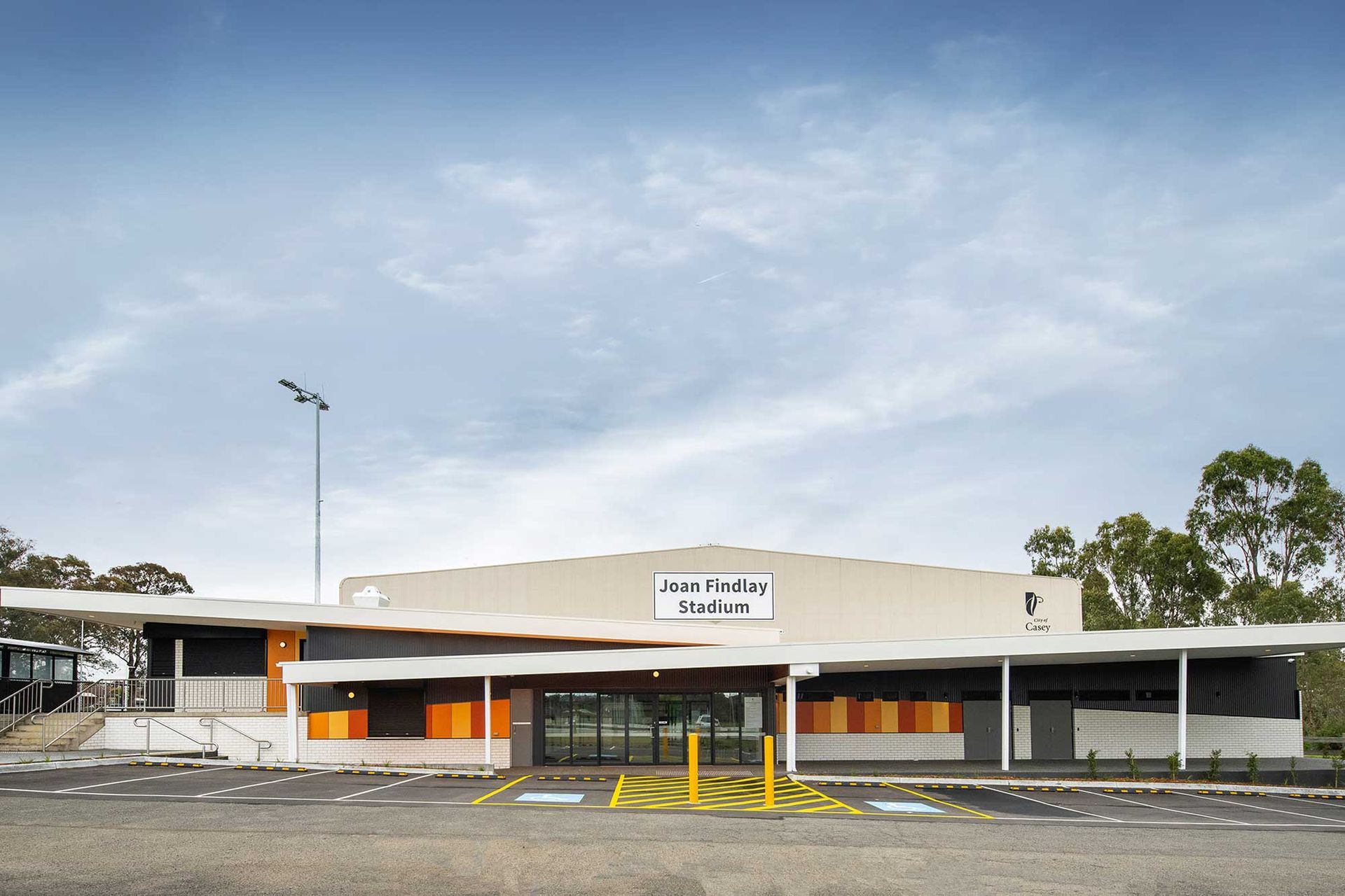 A large building with a parking lot in front of it