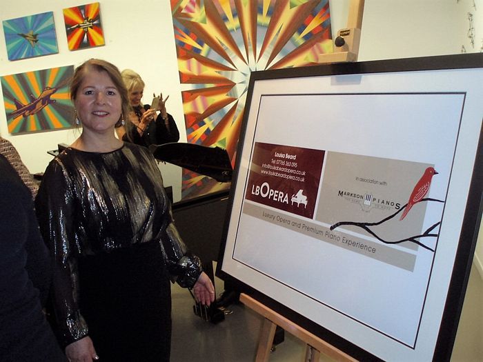 louisa beard near a Louisa Beard Opera banner