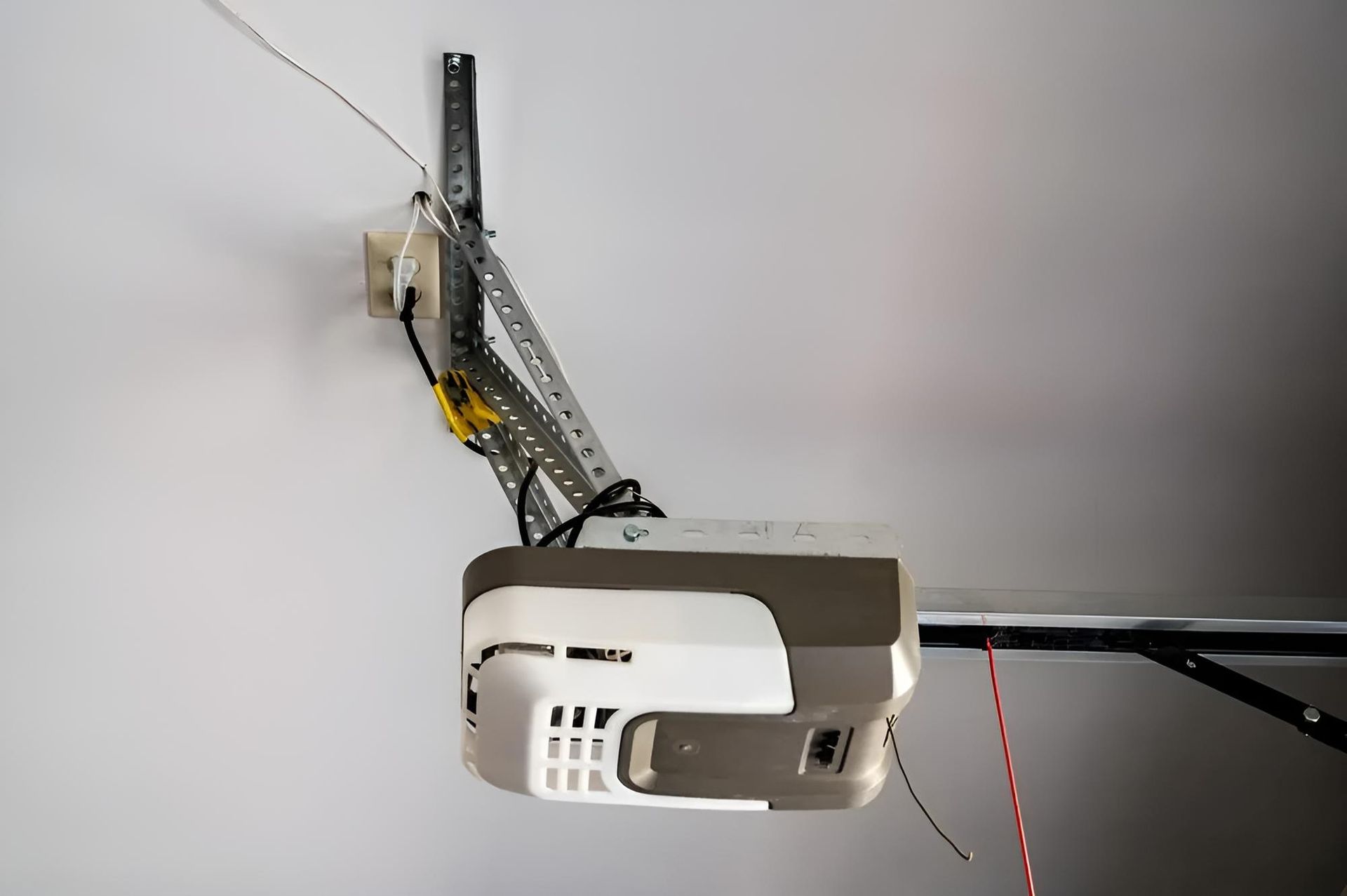 Garage Door Opener is Hanging From the Ceiling — Automated Garage Doors in Chuwar, QLD