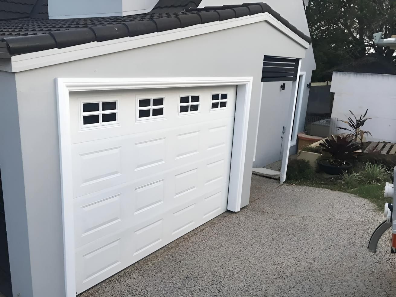 Gray House With White Garage Doors — Automated Garage Doors in Ipswich, QLD