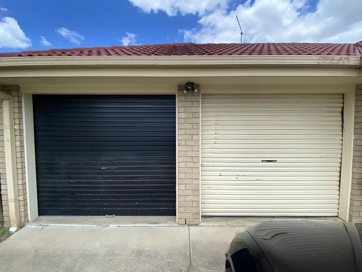 Black and White Garage Door — Automated Garage Doors in Brassall, QLD