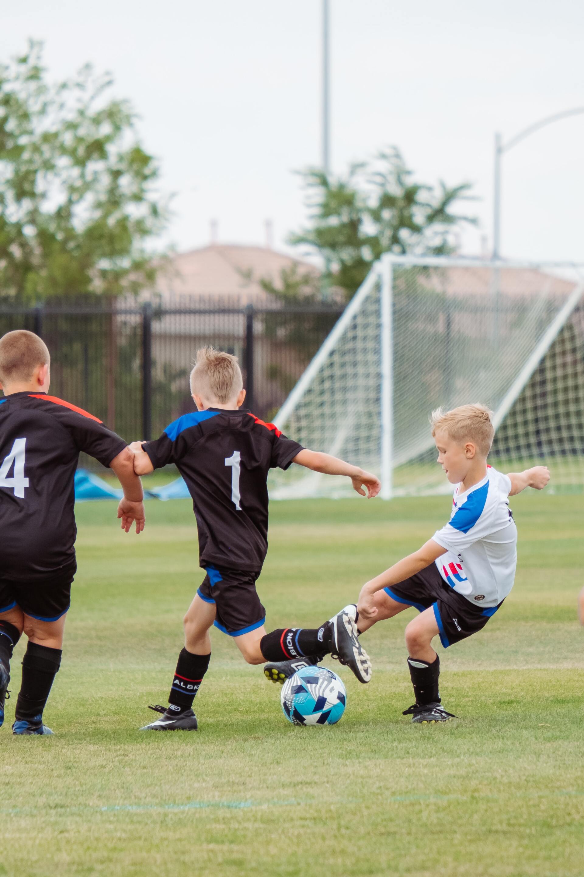 kids playing soccer at community sporting grounds — Ensbey Electrical in Warwick, QLD