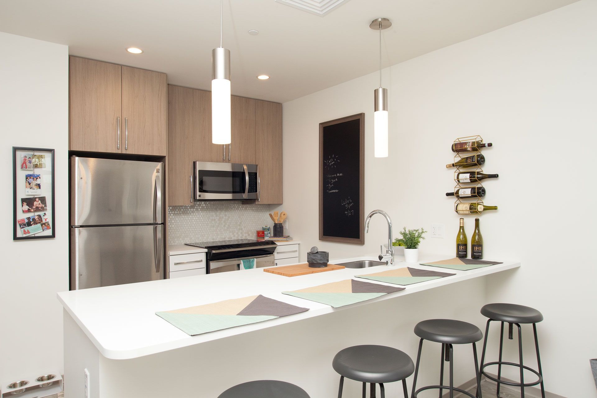 Apartment modern kitchen with oversized island at Trac 75