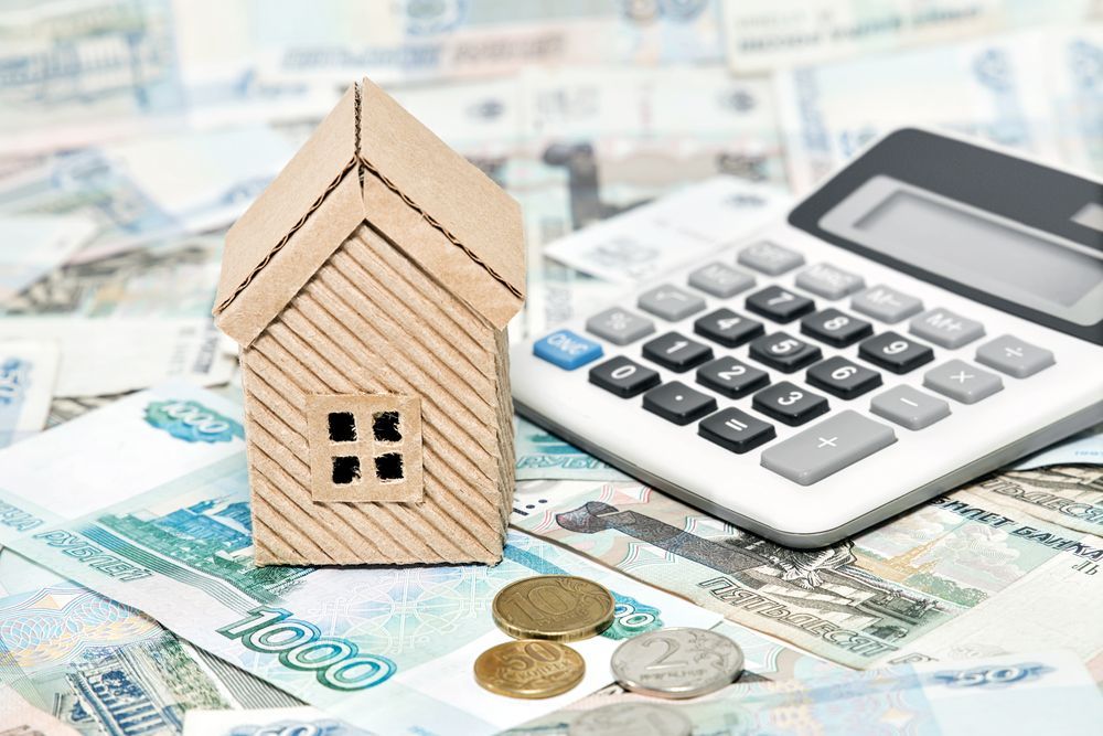 Wooden House Model, Calculator, Coins, and Money — Freedom Wealth Solutions in Pakenham, VIC