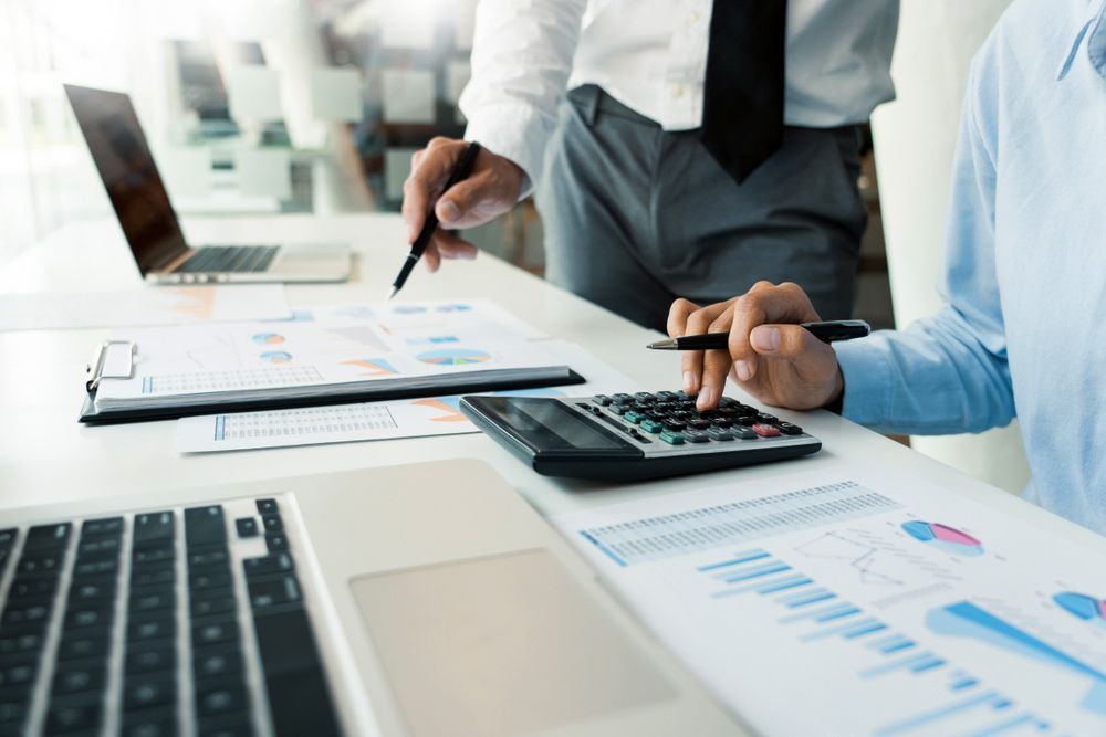 Two People Reviewing Financial Documents — Freedom Wealth Solutions in Mornington, VIC