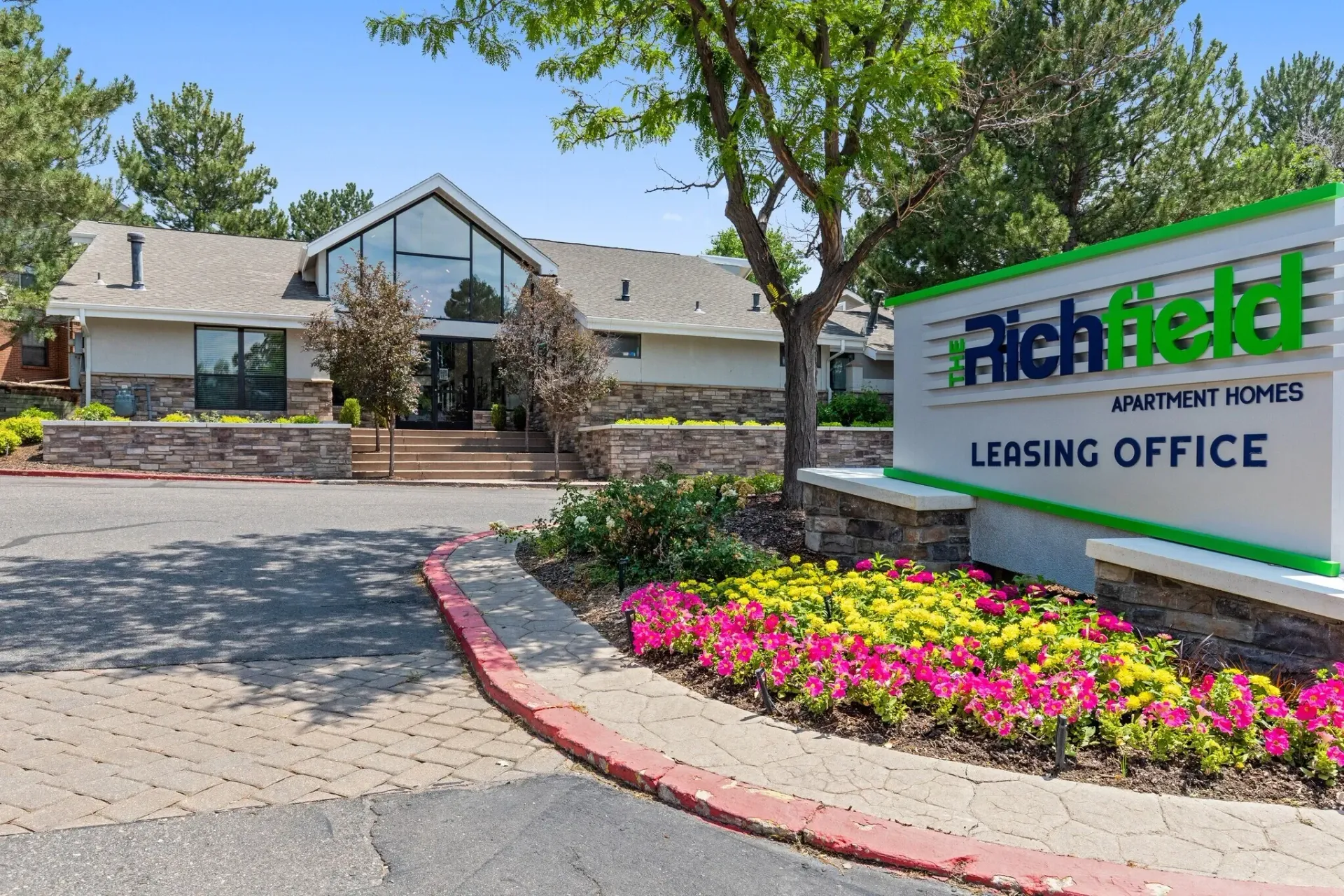 Richfield Apartment Homes leasing office exterior with landscaping.