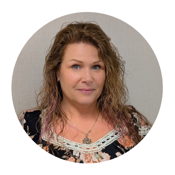 A woman with purple hair is smiling in a circle