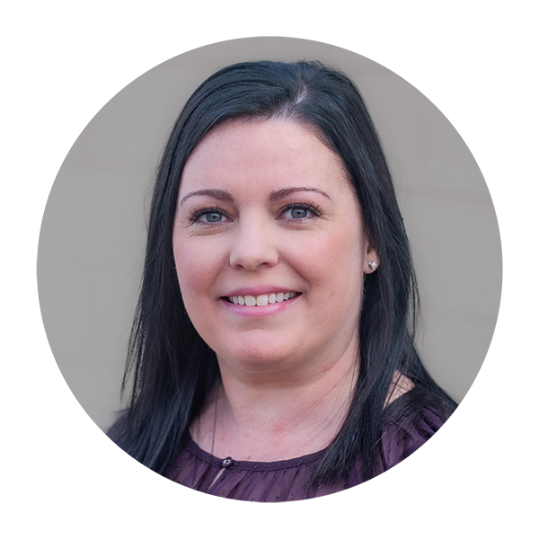 A woman with long black hair is smiling in a circle.