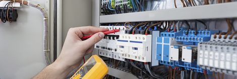 Our residential electricians checking an electrical current in Canberra