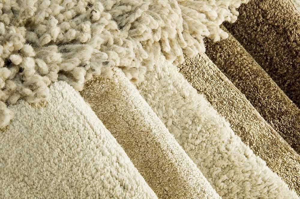 A Close Up of a Stack of Carpets of Different Colors — Great Lakes Carpet Cleaning & Restoration In Taree, NSW
