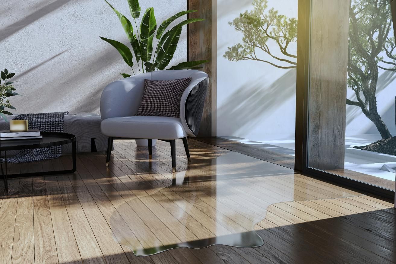 A Living Room With a Chair , Table , and Plant — Great Lakes Carpet Cleaning & Restoration In Mid North Coast, NSW