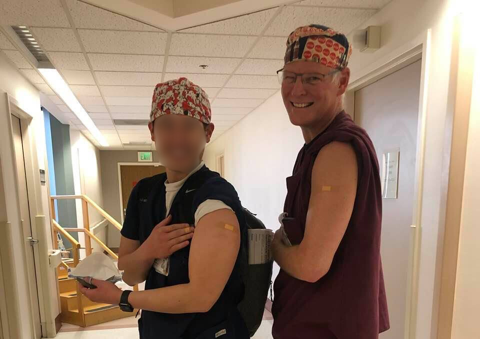 Darrell standing on the deck of his cruise ship leaning on a rail