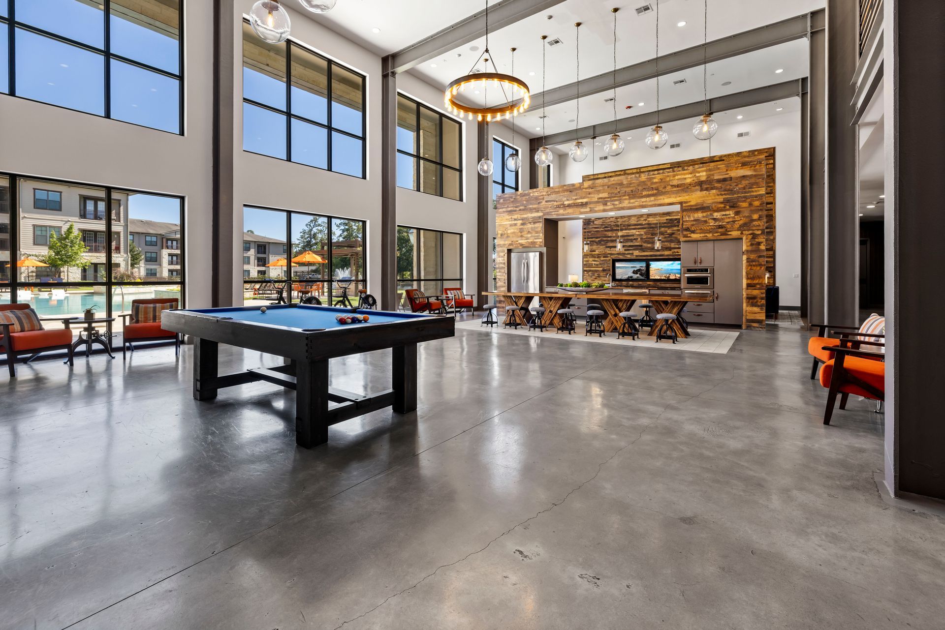 a pool table in the middle of the room.