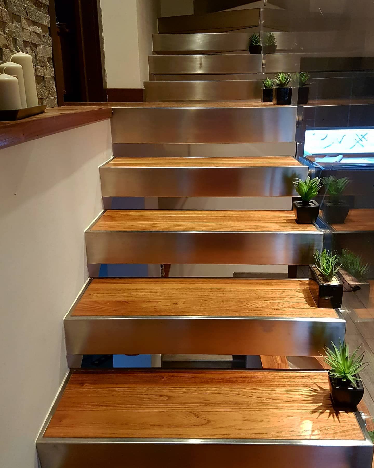 A series of stairs with wooden steps and a metal railing