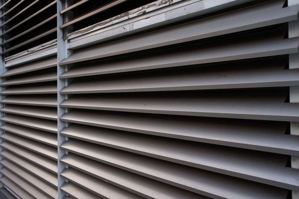 Louvre Window on the Side of a Building — K & J Glass in Kempsey, NSW