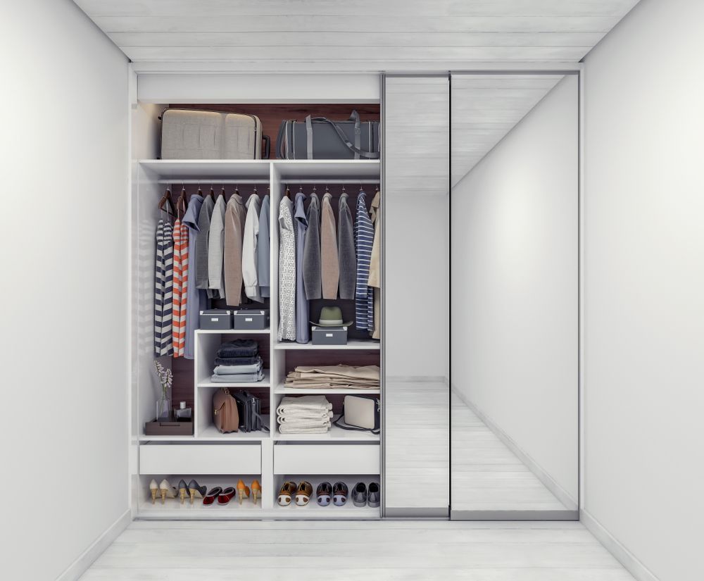 Built-in White Closet With Clothes, and Mirror Doors — K & J Glass in Warrell Creek, NSW