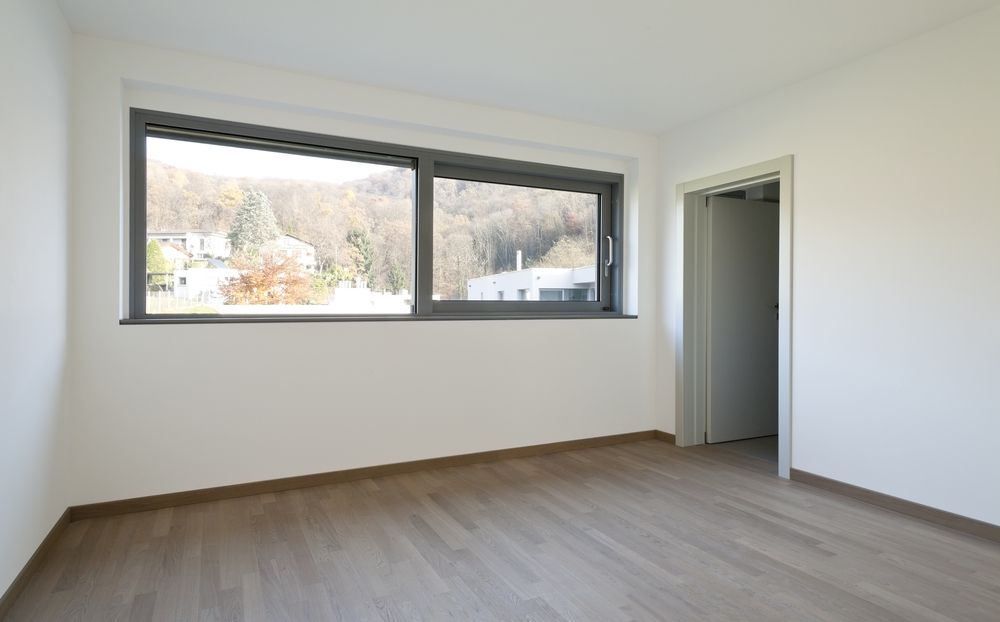 Empty Room With a Large Window Overlooking Trees — K & J Glass in Warrell Creek, NSW