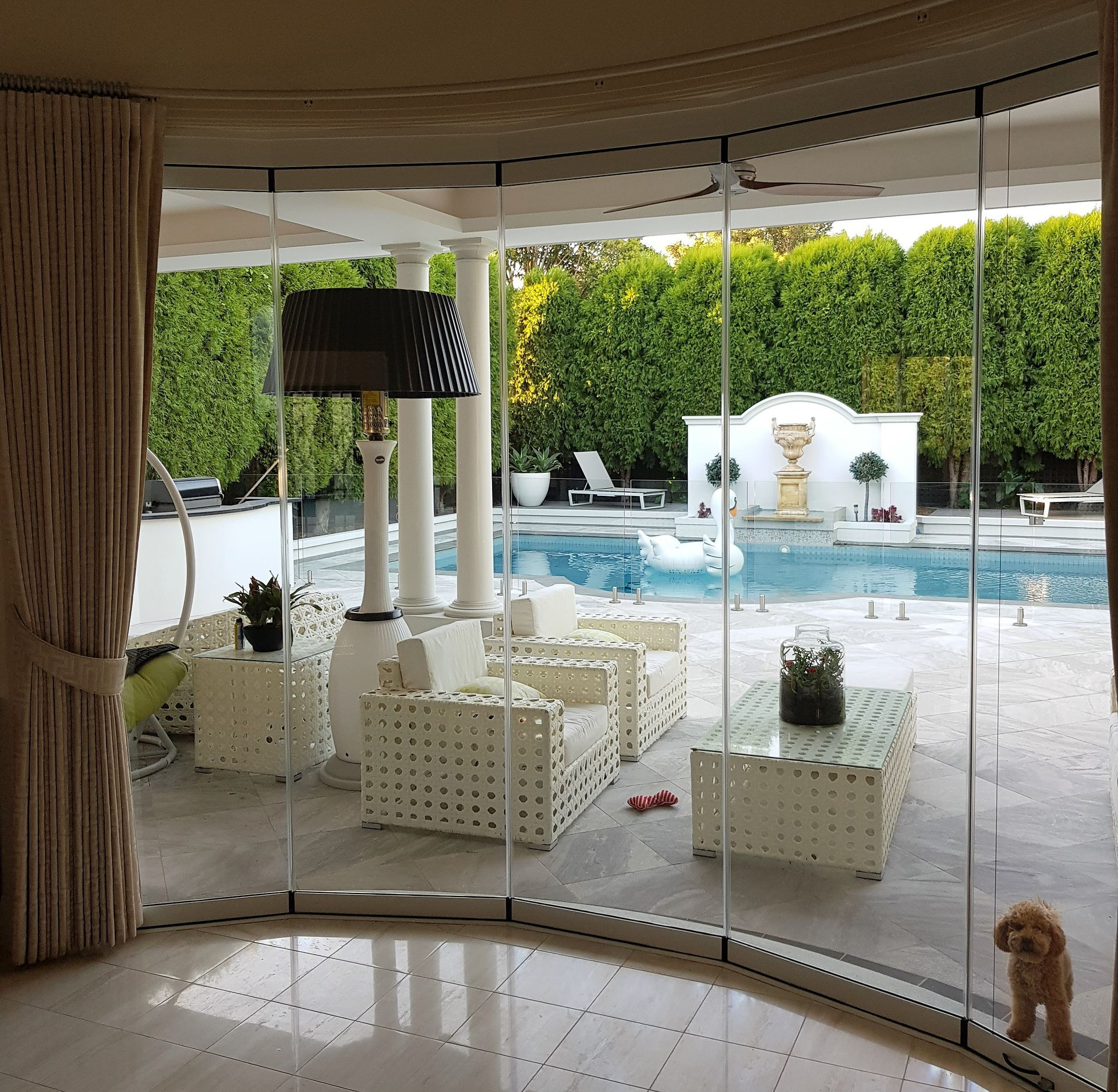 Large Bifold doors facing out to a pool area — K & J Glass in Warrell Creek, NSW