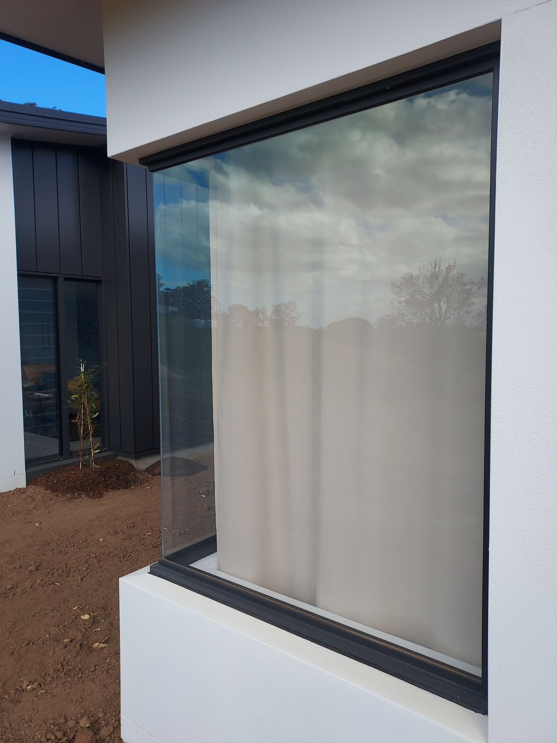 Large, Clear Window on a White Building — K & J Glass in Warrell Creek, NSW