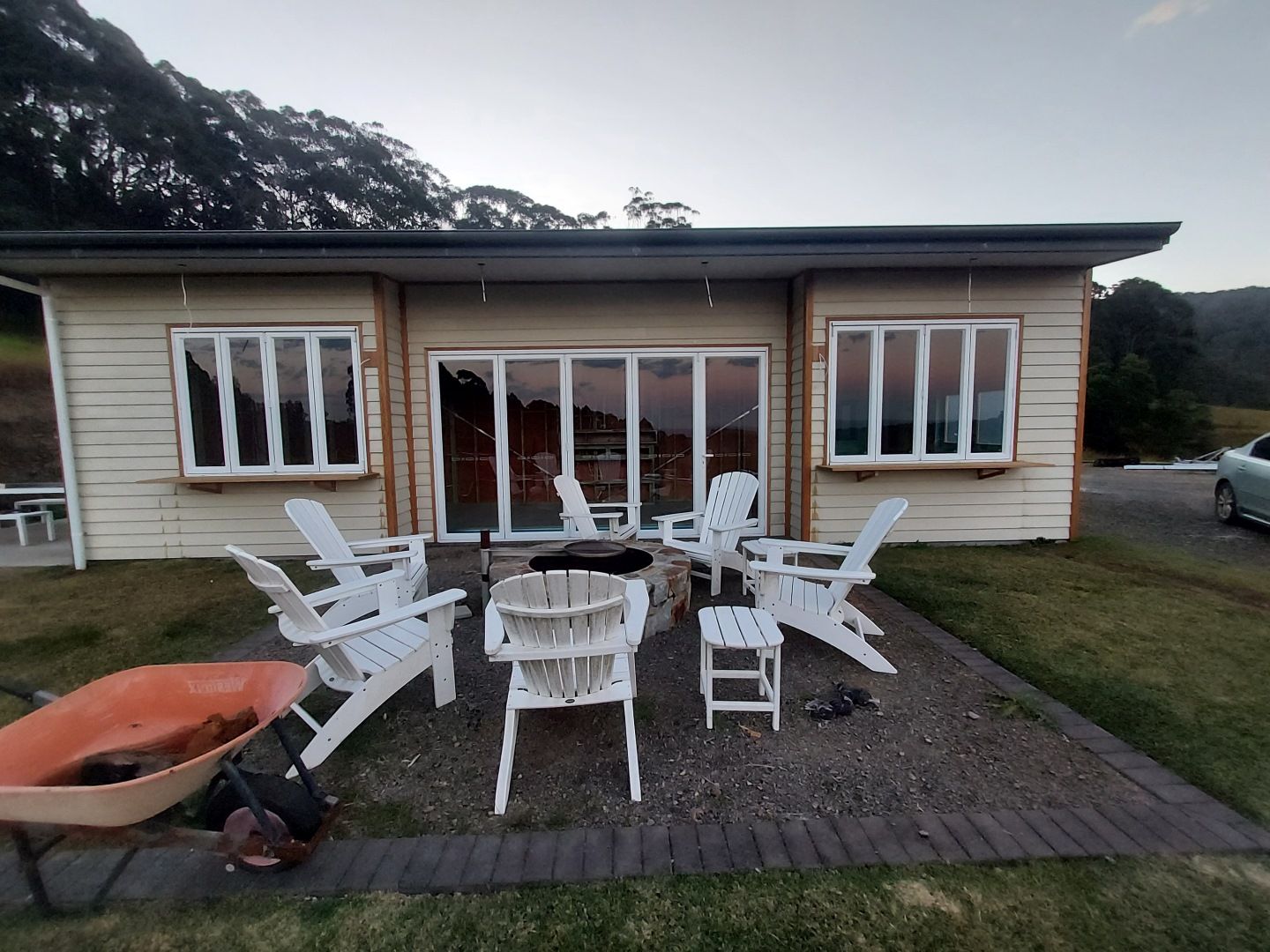Cabin With White Chairs, and Folding Windows — K & J Glass in Warrell Creek, NSW