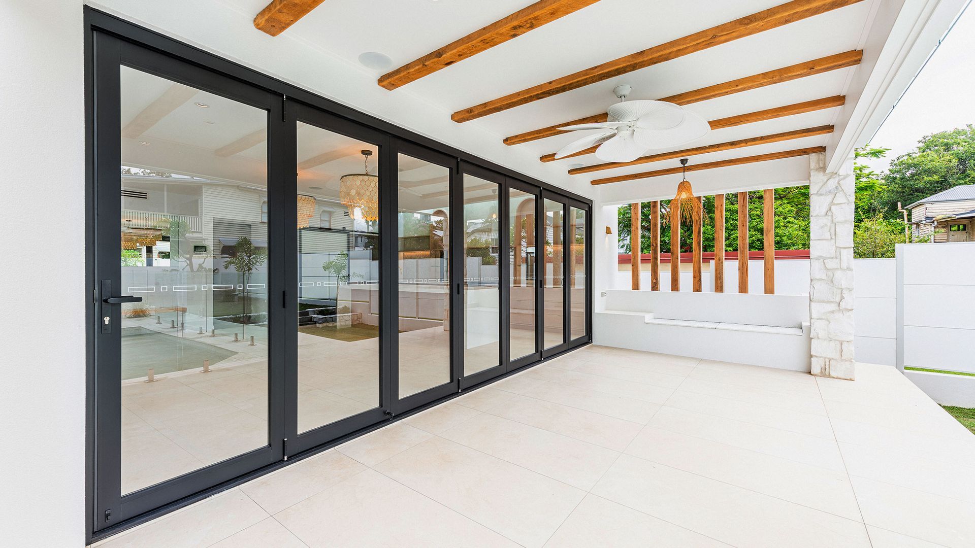 Patio With Large Black-Framed Glass Doors — K & J Glass in Urunga, NSW