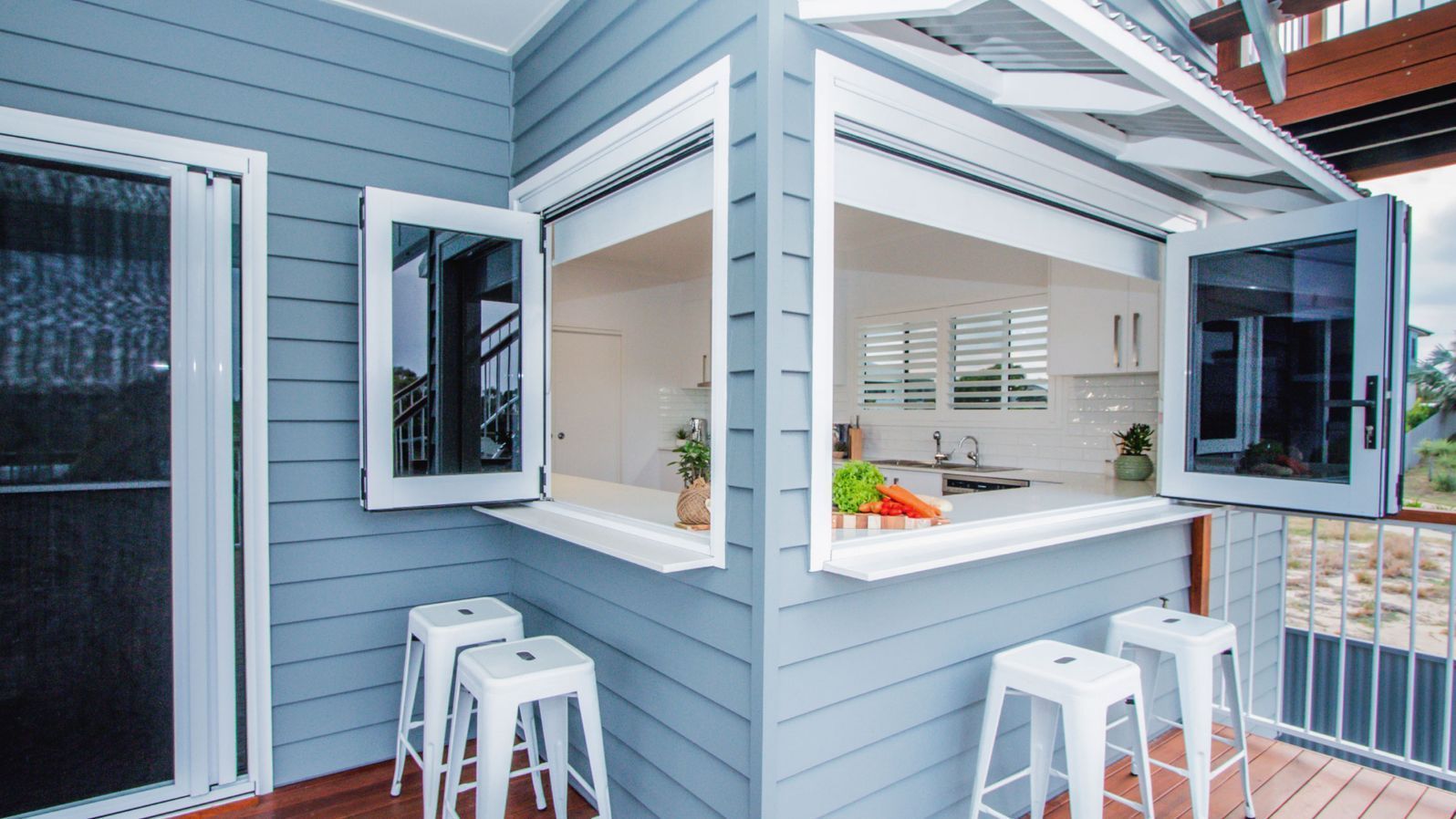 A Bifold window is open in a kitchen area — K & J Glass in Warrell Creek, NSW