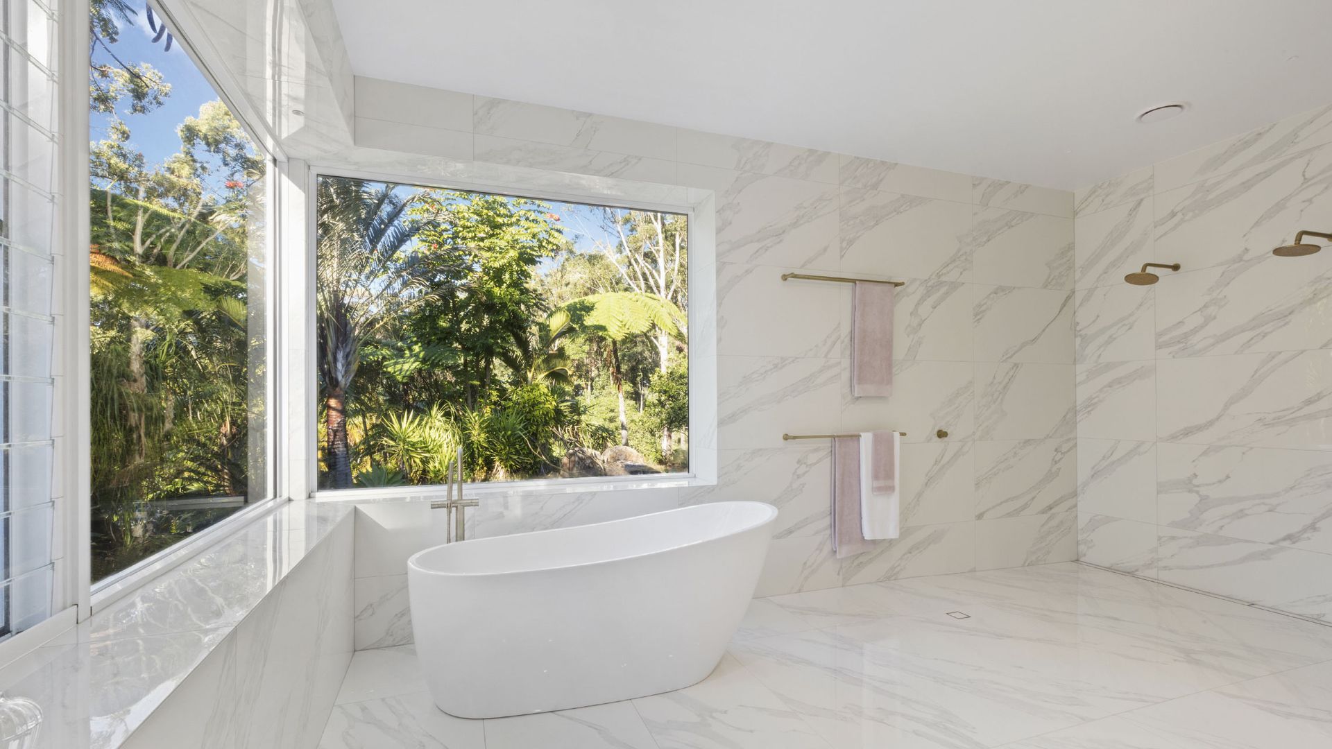 White Bathroom With a Large Window Overlooking Lush Greenery — K & J Glass in Warrell Creek, NSW