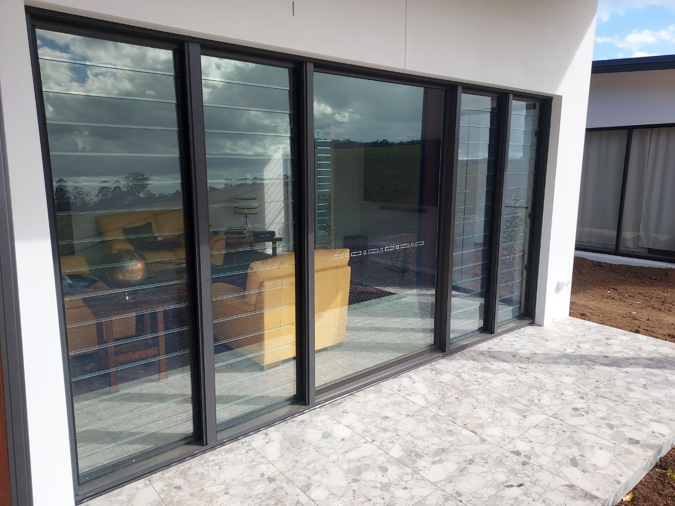 Sliding Glass Doors With Black Frames — K & J Glass in Warrell Creek, NSW