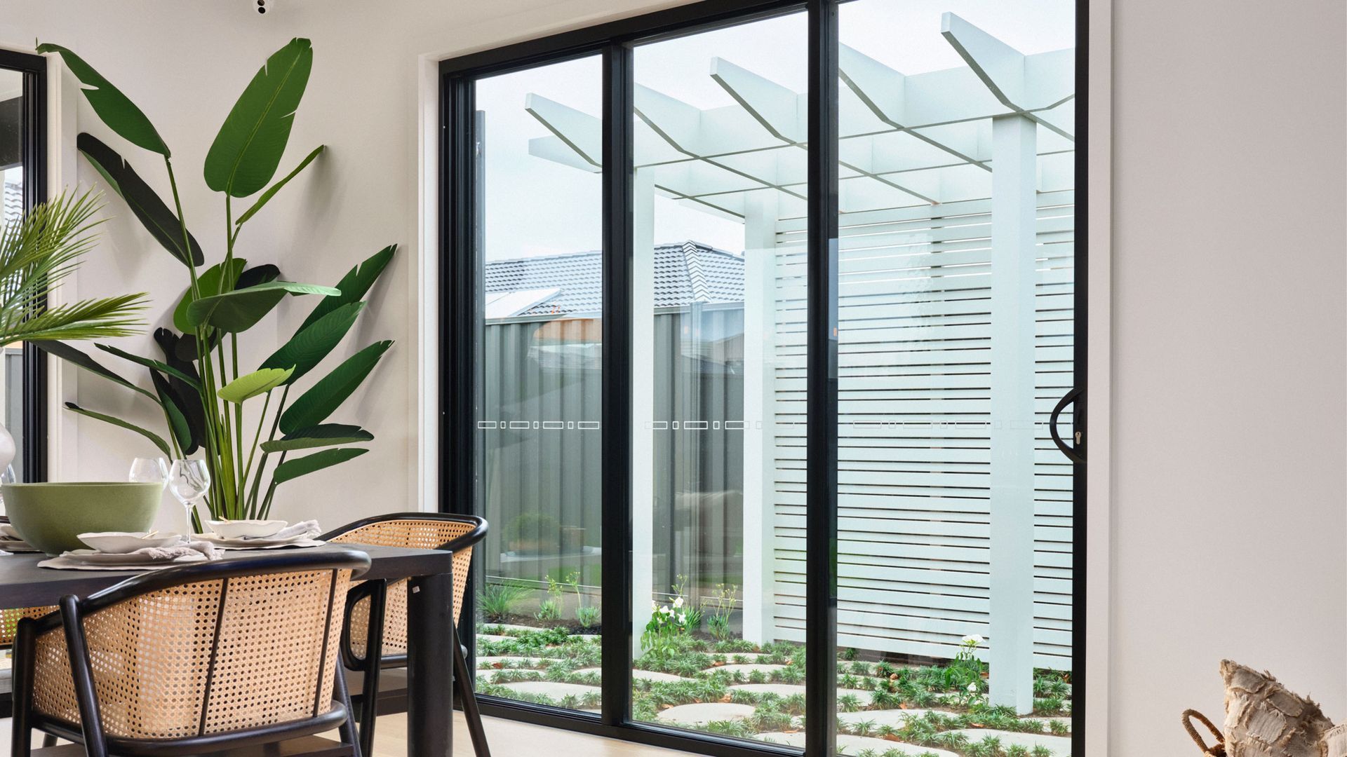 Dining Area With Large Glass Doors — K & J Glass in Warrell Creek, NSW