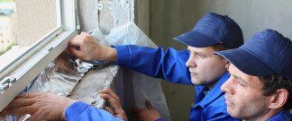 2 men fixing windows