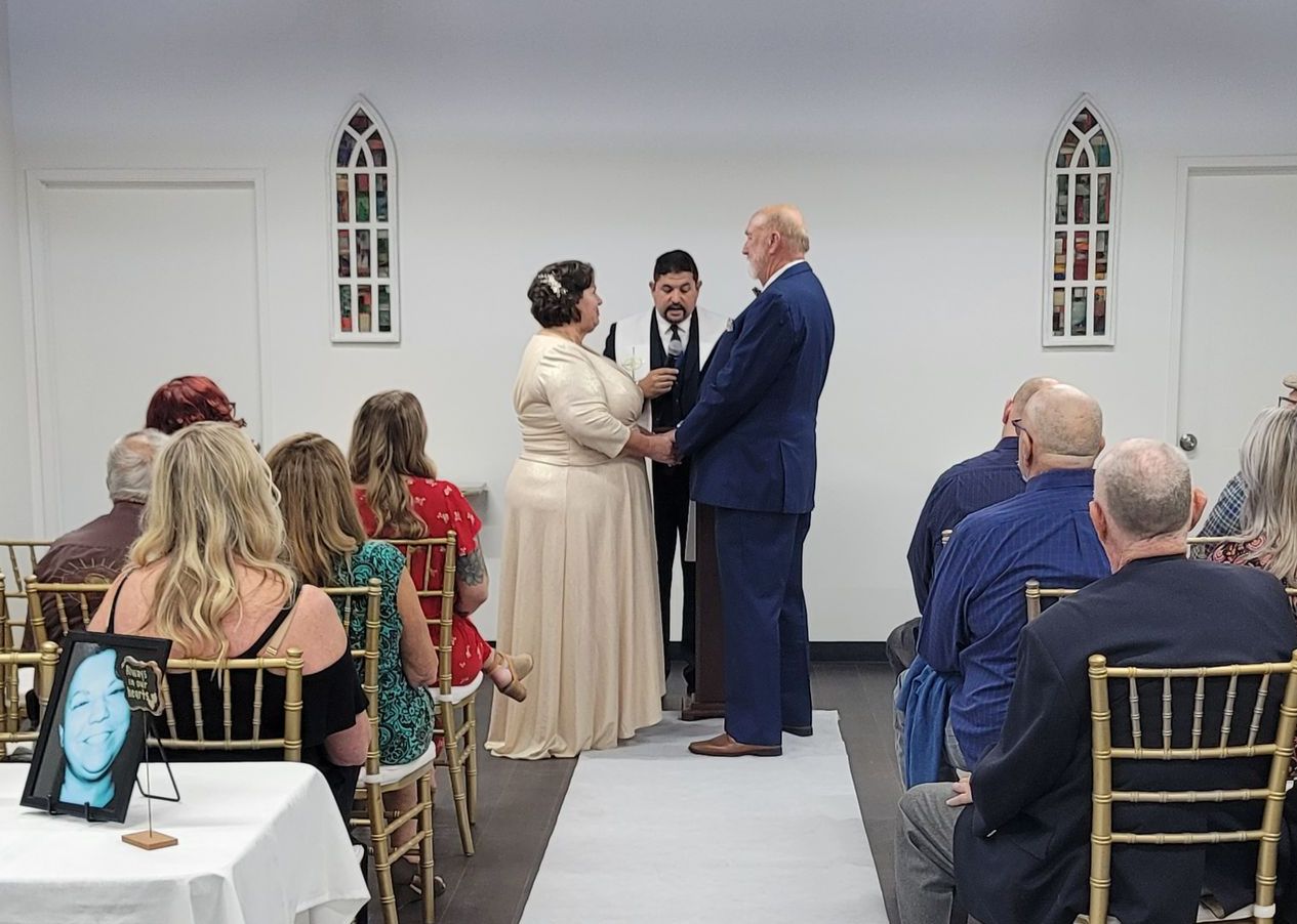 Couple pledging their vows during a wedding ceremony at the Today We Become One Wedding and Event Chapel in Palm Desert, CA
