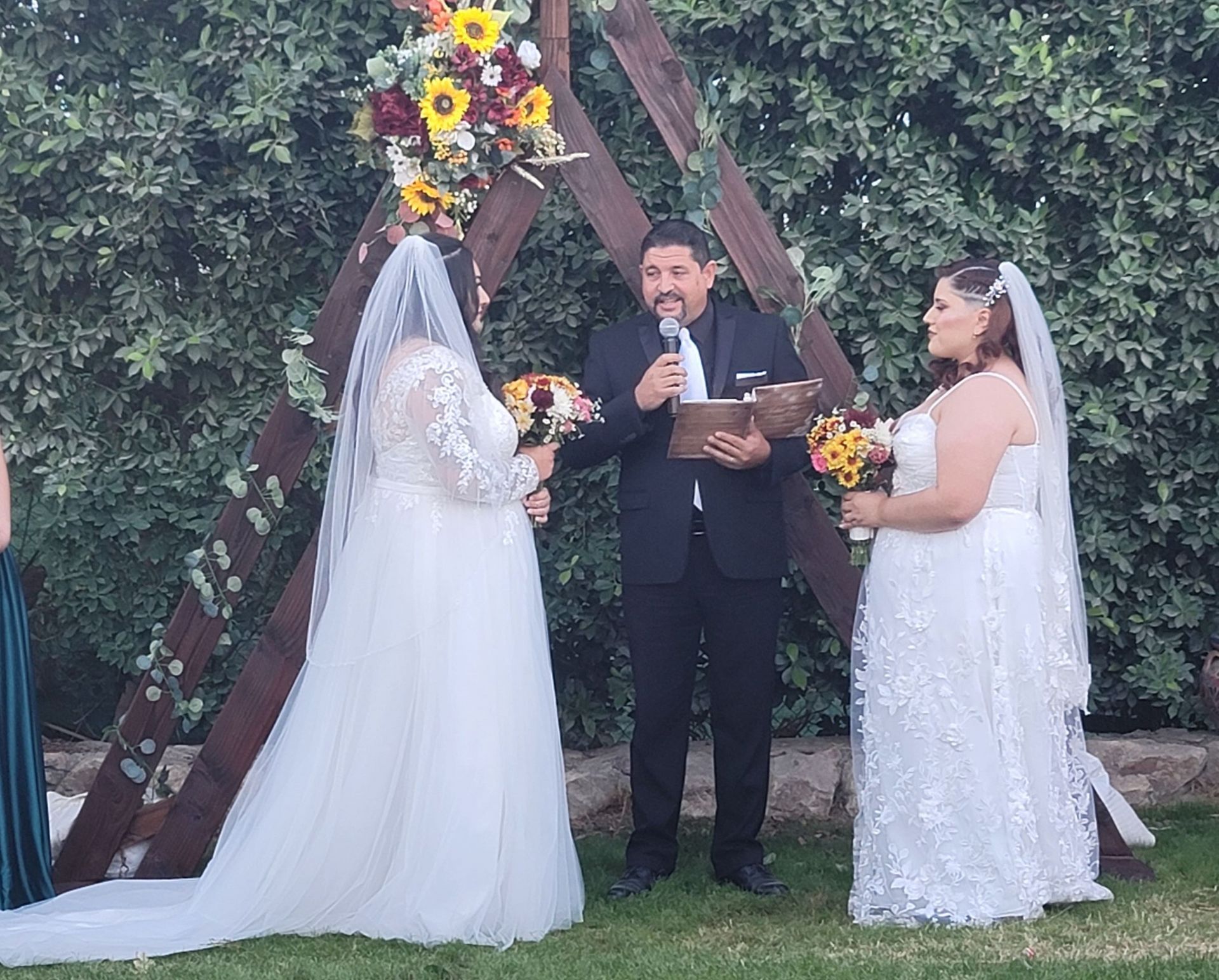 Two Brides exchange vows at Rancho el Refugio in Thousand Palms, CA during a ceremony spoken by Rev. Steve
